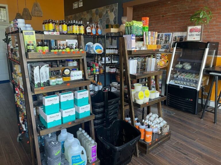 wooden shelves stocked with goods from Be Well Market